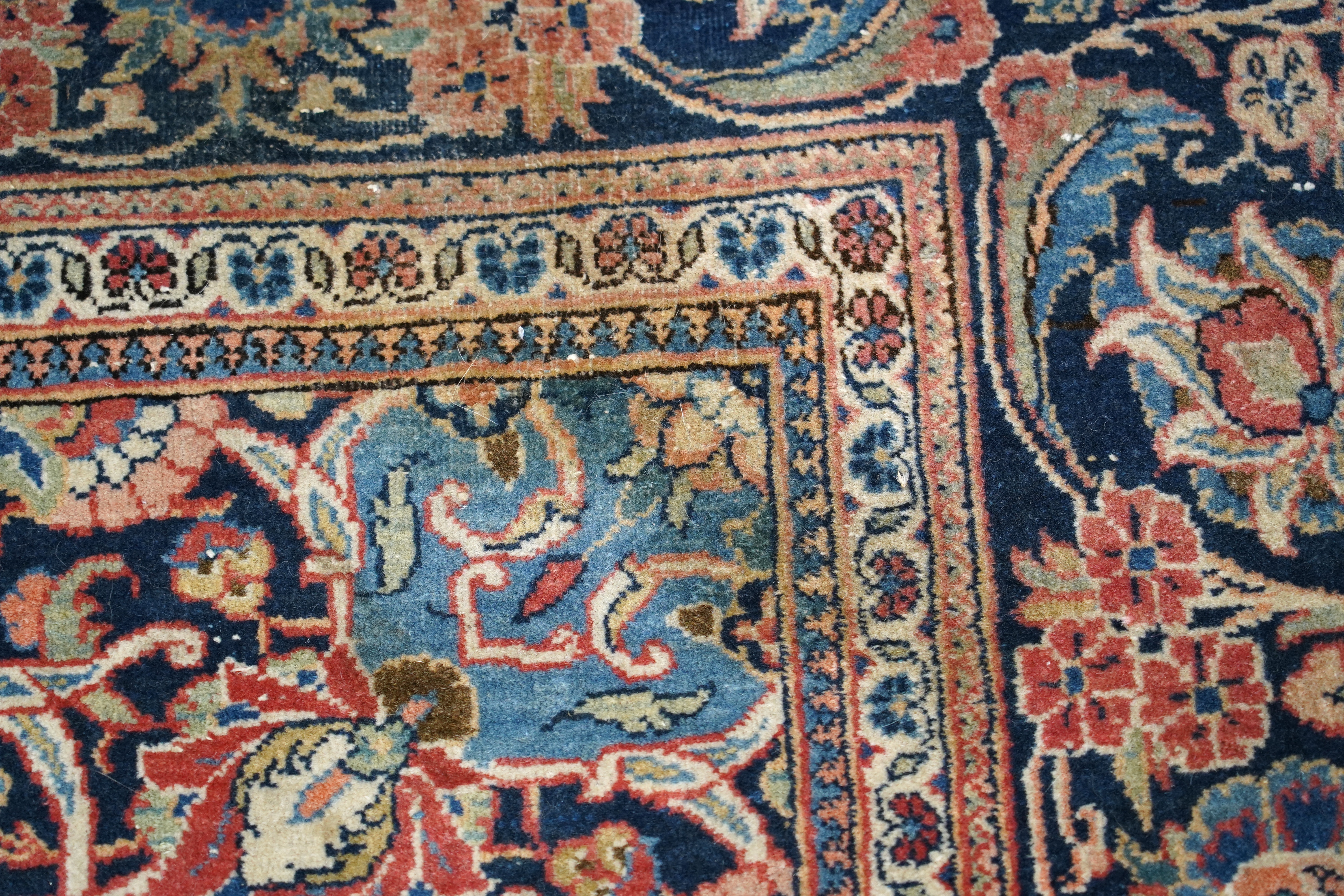 A pair of antique Tabriz brick red ground rugs, 200 x 136cm. Condition - fair